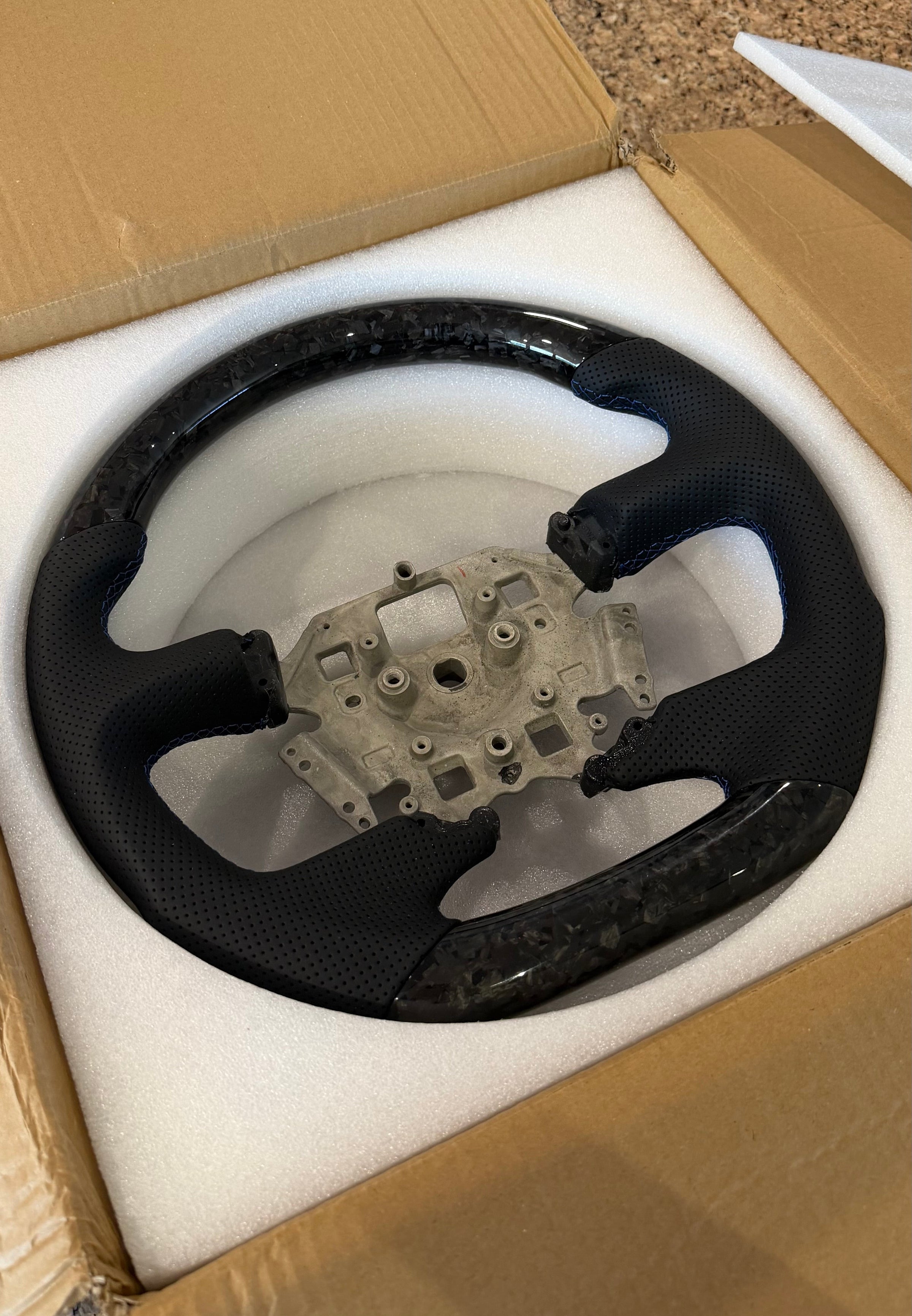 Forged carbon steering wheel with integrated LED display for a Ford Falcon